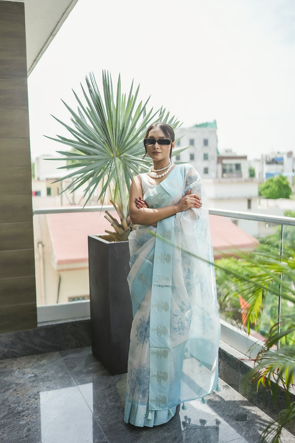 Elegant White and light Blue Organza saree with Floral Prints and Satin Border