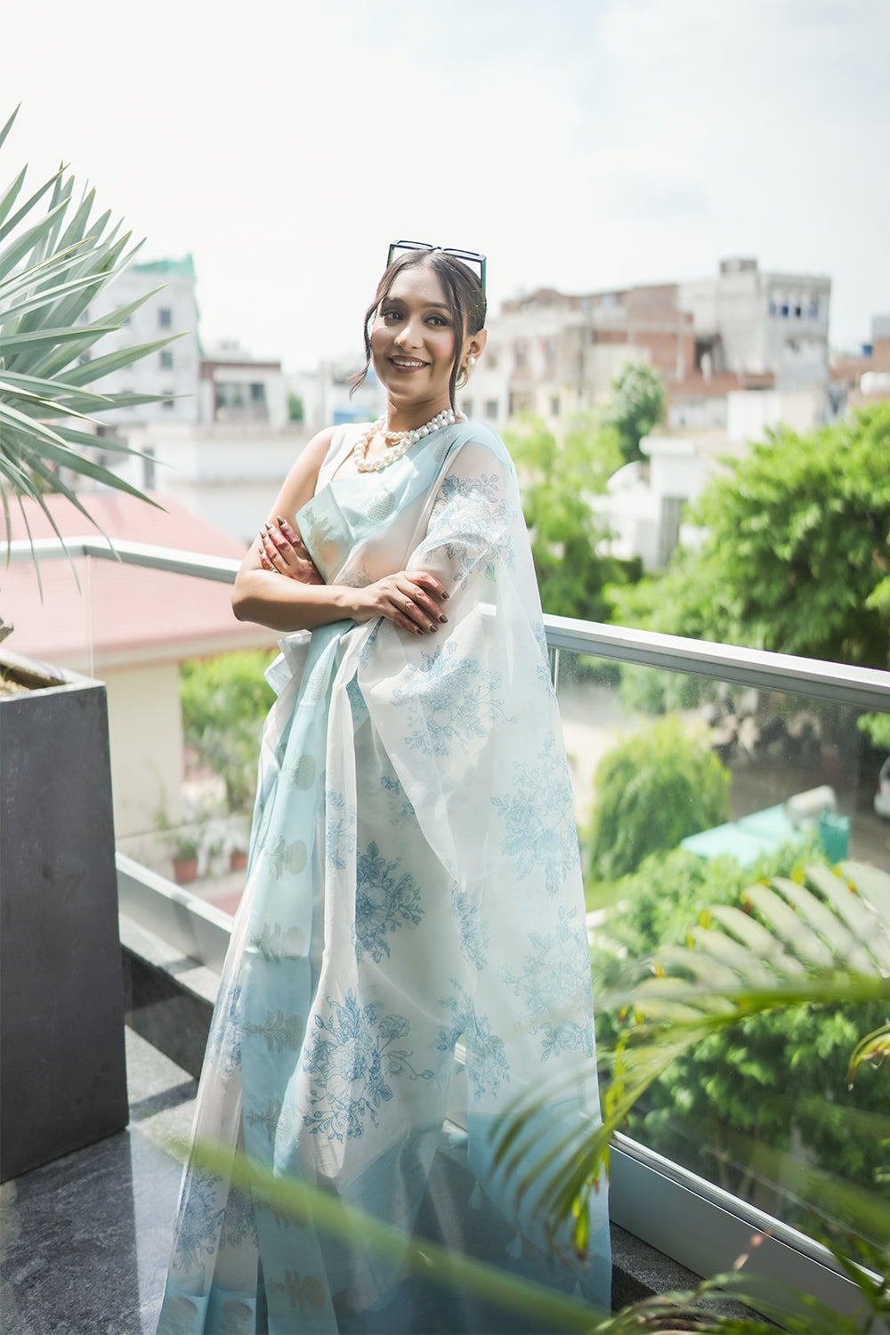 Elegant White and light Blue Organza saree with Floral Prints and Satin Border