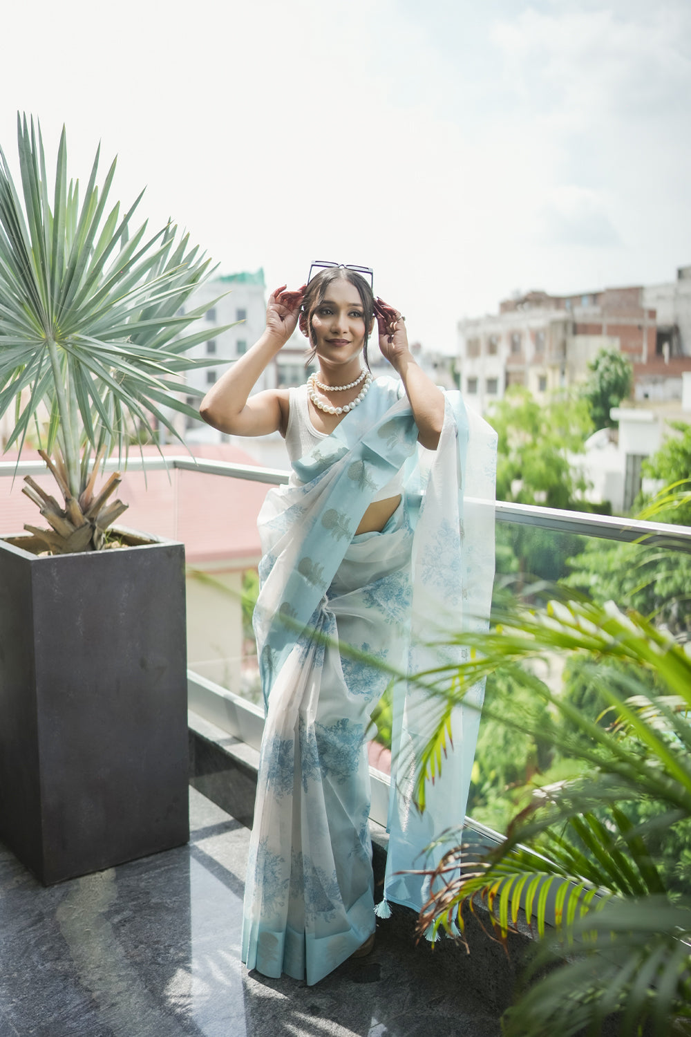 Elegant White and light Blue Organza saree with Floral Prints and Satin Border