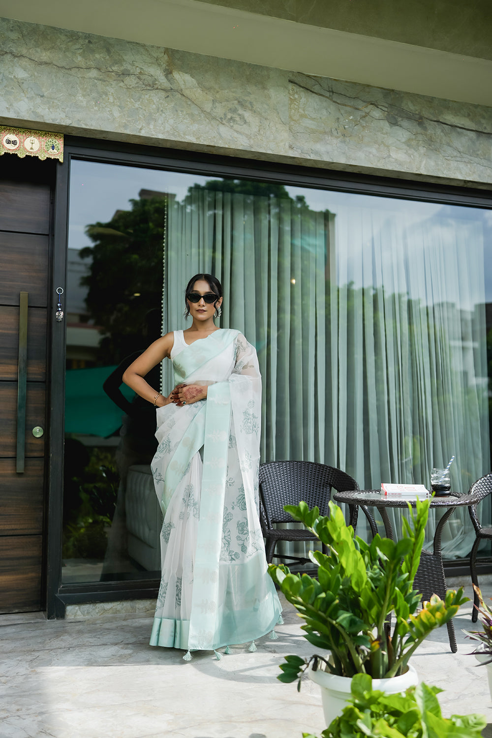 Elegant White and Mint Green Organza saree with Floral Prints and Satin Border