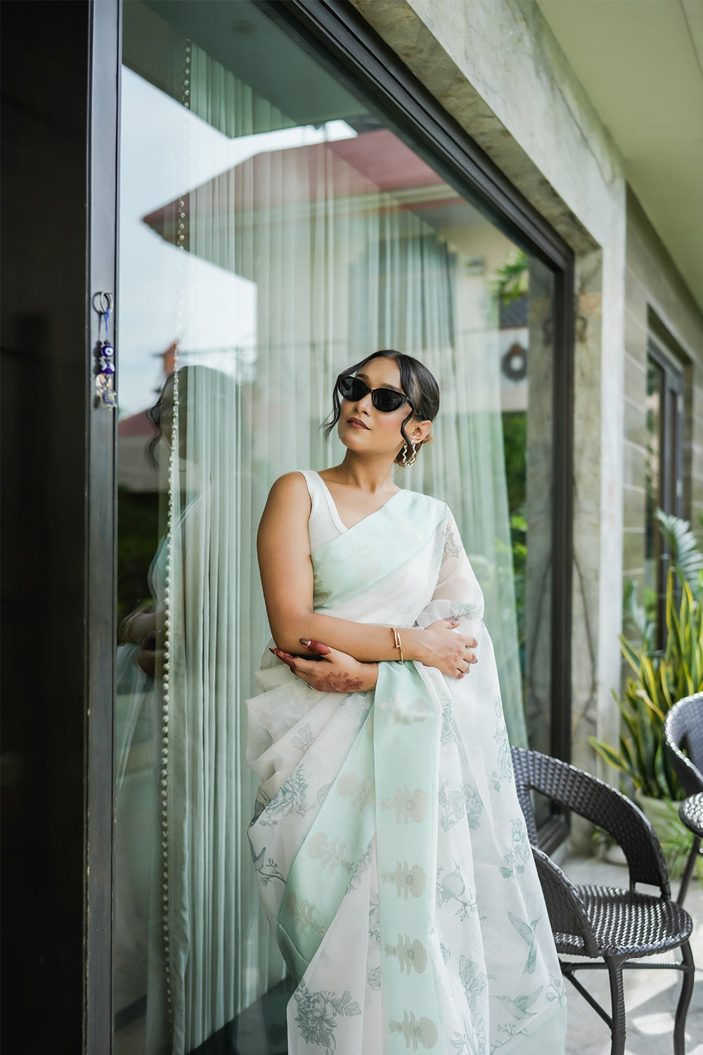 Elegant White and Mint Green Organza saree with Floral Prints and Satin Border