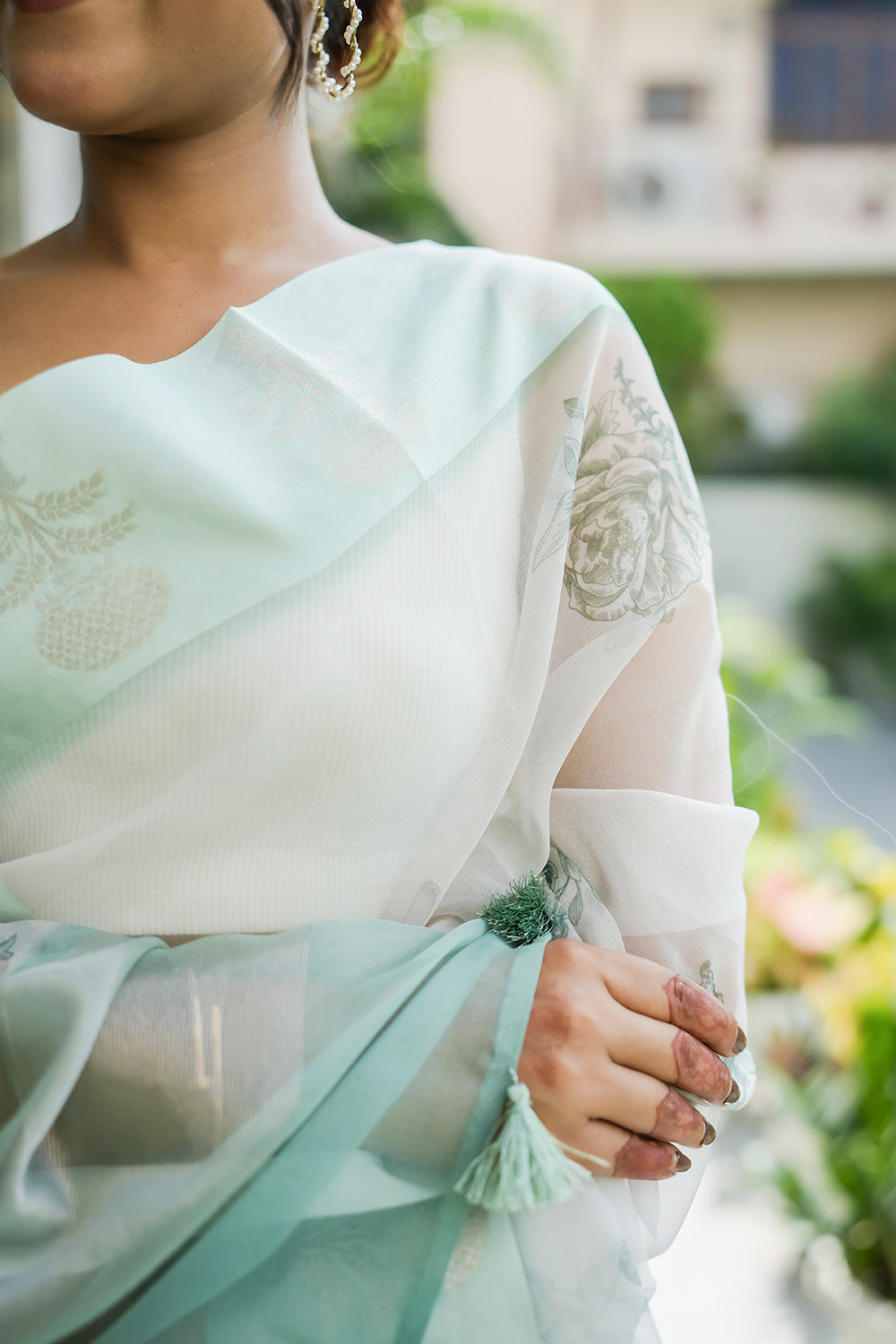 Elegant White and Mint Green Organza saree with Floral Prints and Satin Border