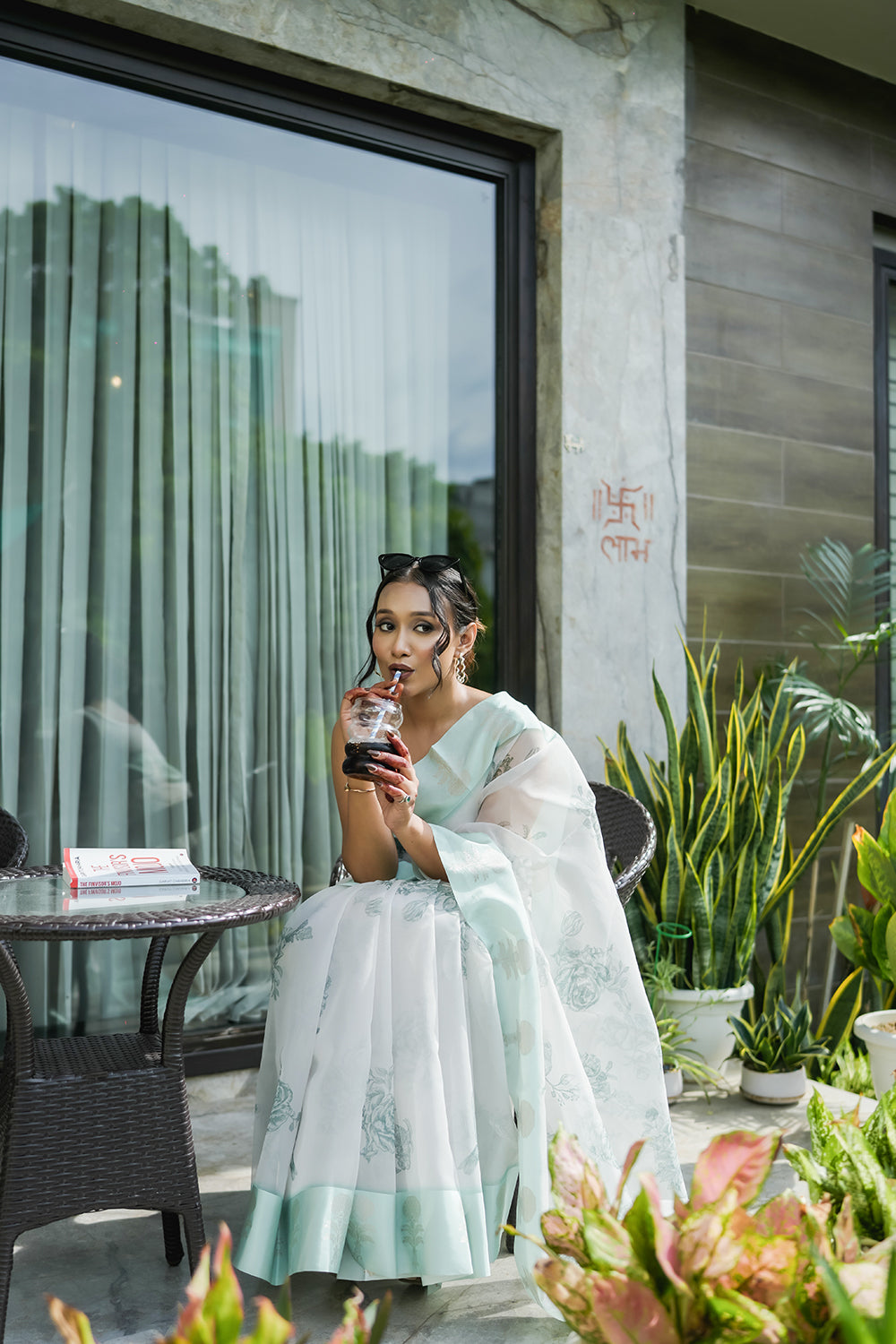 Elegant White and Mint Green Organza saree with Floral Prints and Satin Border