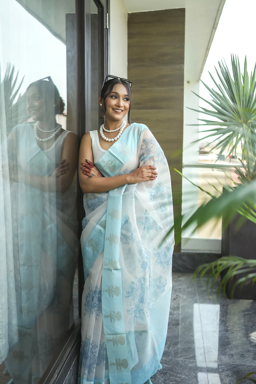 Elegant White and light Blue Organza saree with Floral Prints and Satin Border