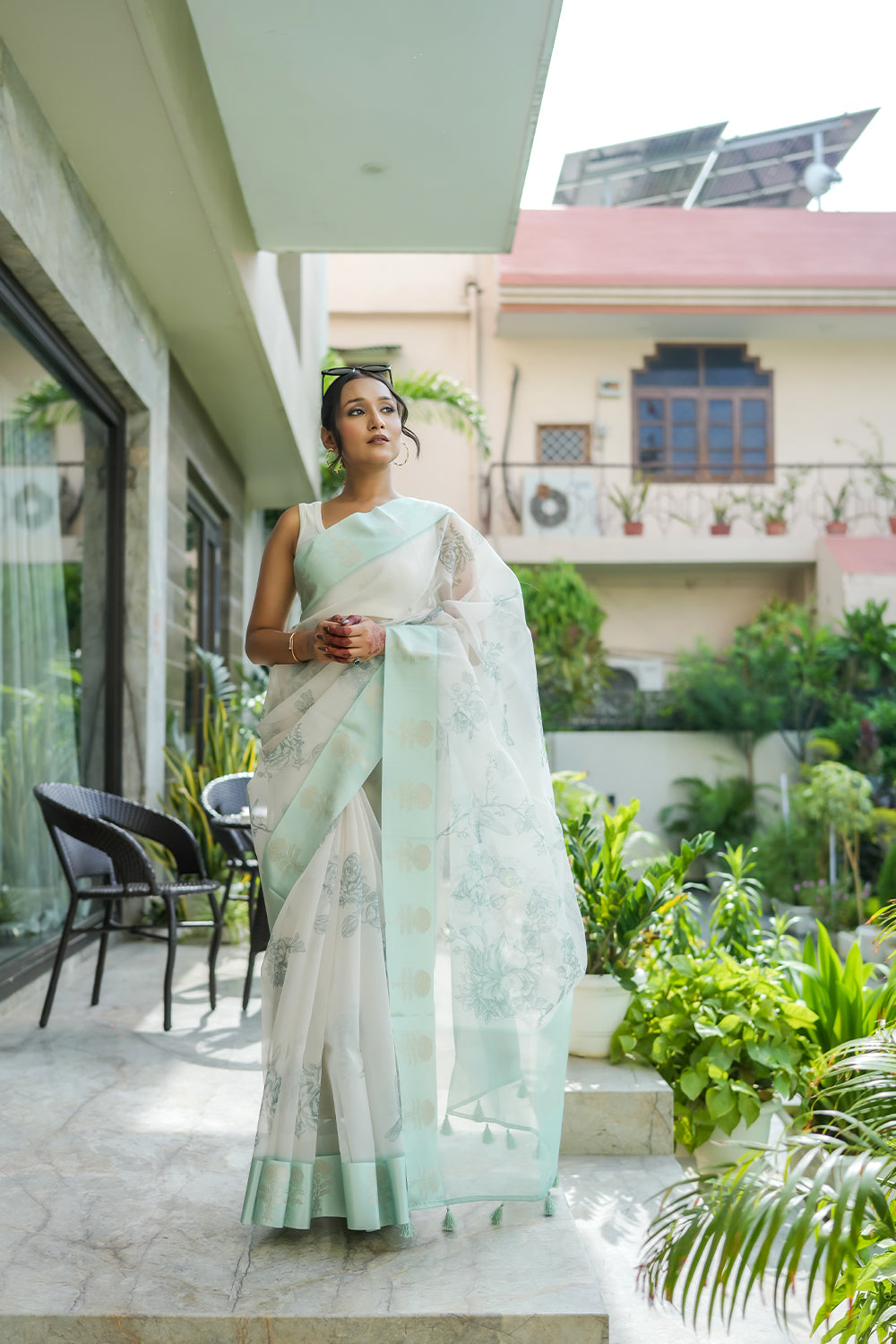 Elegant White and Mint Green Organza saree with Floral Prints and Satin Border