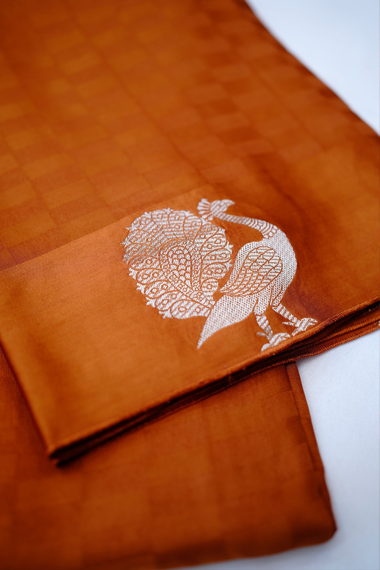 Orange peacock buta silk saree